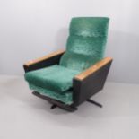 A mid-century reclining swivel lounge chair.