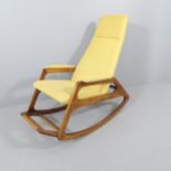 A mid-century beech and upholstered ULUV rocking chair. No label present. Fabric is a little
