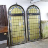 A pair of stained glass leadlight arch-top windows. 78x184cm. One missing and one damaged panel.
