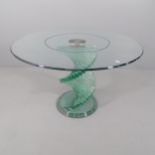 A contemporary circular glass table with stepped spiral base, in the manner of Danny Lane. 121x78cm.