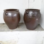A pair of treacle glazed terracotta garden pots. 44x50cm.
