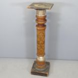 An antique mahogany and onyx pedestal, the turned column having carved decoration. Height 106cm. A/