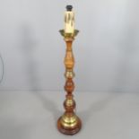 A turned mahogany and brass mounted standard lamp. H to screw fitting - 134cm. 2-pin plug fitted,