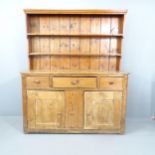 An antique reclaimed pine two section dresser. 156x183x55cm