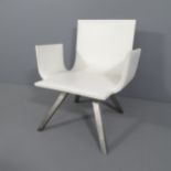 A contemporary design white leather lounge chair on steel legs.