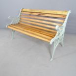 A pine slatted garden bench with painted cast iron ends. 124x71x56cm.