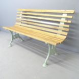 A pine slatted garden bench with painted gothic cast iron ends. 170x74x44cm.