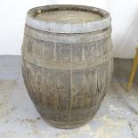 A vintage coopered-oak barrel. 78x95cm.