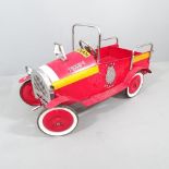 A vintage painted child's pedal fire engine. 116x66x50cm.