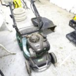 An ATCO liner 16s petrol lawn mower.