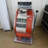 A 1960s Sega Copper Star One Arm Bandit penny arcade slot machine.