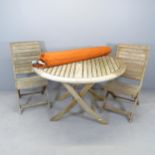 A weathered teak folding circular garden table by Alexander Rose (with maker's label), 120x76cm,