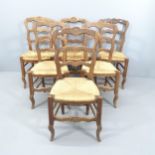 A set of six French oak ladder back dining chairs, with rush seats.