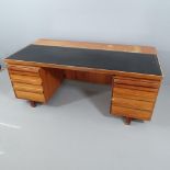 A mid-century Danish style teak twin-pedestal desk in the manner of Andreas Pedersen, with embossed