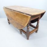 A Charles II oak oval gateleg dining table, with end frieze drawer, circa 1680. 154x78x54cm