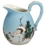 A Japanese porcelain jug with painted cranes, signed under base, height 13cm Handle restored