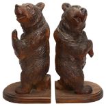 A pair of 19th century Black Forest carved and stained wood standing bears, height 30cm Good