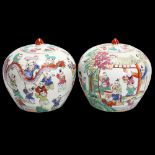 A pair of 20th century Chinese porcelain jars and covers with painted decoration, height 20cm