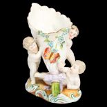 19th century porcelain cornucopia vase supported by 3 cherubs, no factory marks, height 14cm Front