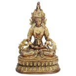 A Chinese gilt-bronze seated Buddha, height 22cm