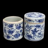 A pair of Chinese blue and white porcelain cylindrical pots, with painted birds (1 lid missing),