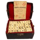 A Chinese Mahjong set, bone and bamboo, in original leather case