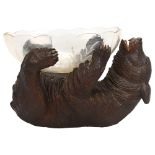 19th century Black Forest carved and stained wood bear supporting a cut-glass bowl, length 30cm Good