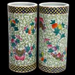 A pair of 20th century Chinese porcelain cylinder vases, height 28cm, and a pair of blue and white