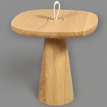 A Daniel Schofield Migo table by Mor, made from solid oak, the removable top sitting over a