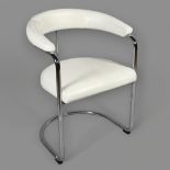 A mid-century modernist Anton Lorenz SS 33 style cantilever armchair in tubular steel and white