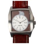 A Tintin steel cased watch with leather strap, Japanese movement, working order, case width 4cm Some