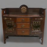 A Liberty & Co Arts and crafts sideboard, manufactured circa 1900, mahogany with planished copper