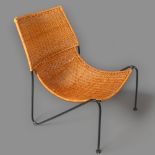 A mid-century rattan lounge chair on hairpin iron frame in the manner of Frederick Weinberg,