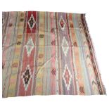 A large vintage Kelim rug, 3 joined panels, 250 x 183cm Good vintage condition, some fading and