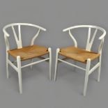Hans Wegner, a pair of Danish Wishbone dining chairs by Carl Hansen, with maker's plaques, height