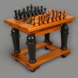 A 1970’s brutalist pine chess table by Brumblefly, with internal storage compartment holding the