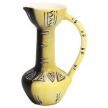 A tall bi-colour Vallauris ceramic ewer / carafe, with sgraffito and brushwork decoration, signed