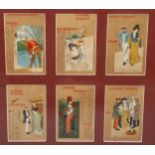 A framed group of 6 printed postcards, circa 1900, with handwritten inscriptions, images signed M