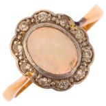 An 18ct gold opal and diamond oval cluster ring, set with oval cabochon opal and single-cut