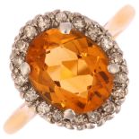 An 18ct gold citrine and diamond oval cluster ring, platinum-topped with oval mixed-cut citrine