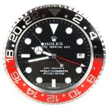 **WITHDRAWN** A reproduction Rolex style GMT-Master II Date "Coke" quartz wall clock, diameter 34cm