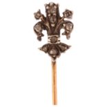 A 19th century diamond fleur-de-lis stickpin, unmarked gold and silver settings with rose-cut