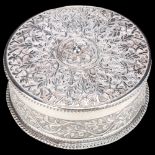 An Indian silver dressing table box, allover relief embossed floral decoration with rope twist