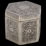 An Indian silver trinket box and cover, hexagonal form with relief embossed floral decoration, width