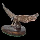 An African miniature silver model eagle catching a fish, Patrick Mavros (unsigned), undated, on