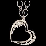 A large modern diamond openwork heart pendant necklace, unmarked 18ct white gold settings, with