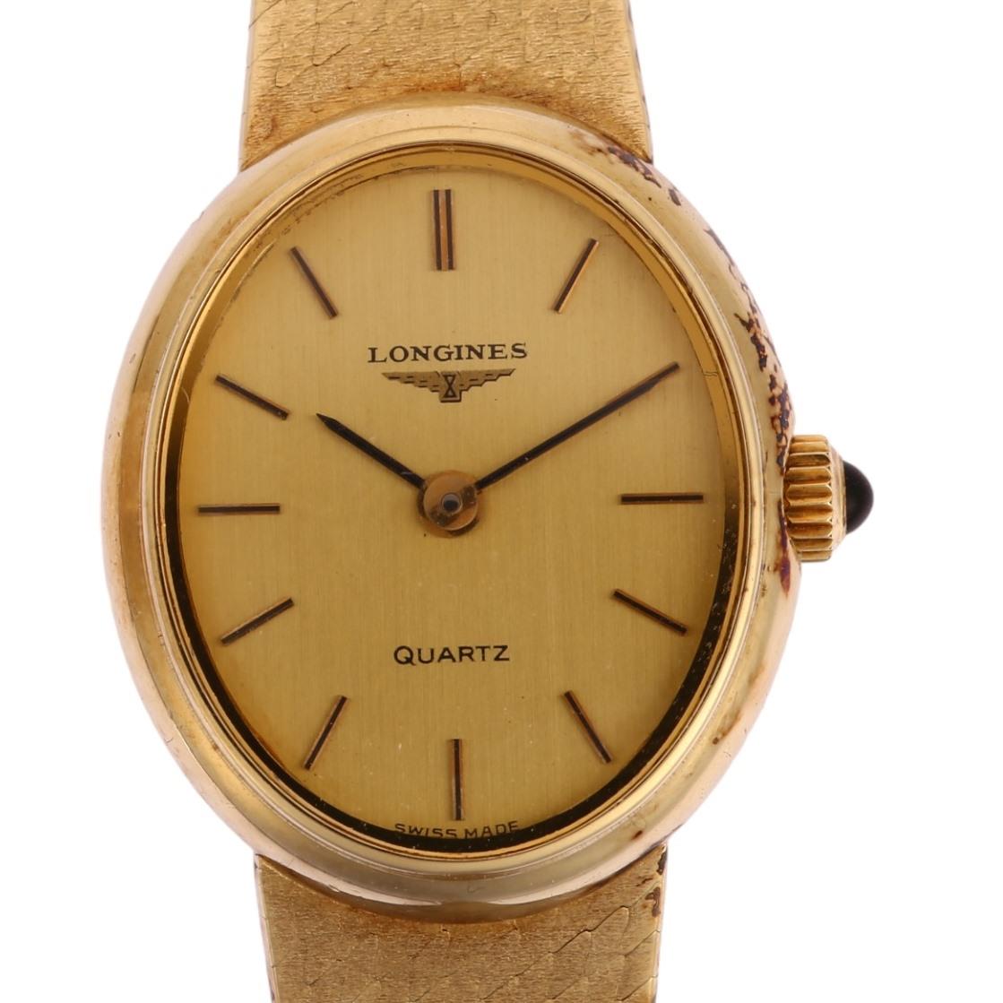 LONGINES - a lady's 14ct gold quartz bracelet watch, circa 1980s, champagne dial with applied gilt