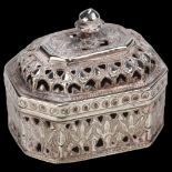 A small Indian silver trinket box and cover, elongated octagonal form with pierced and relief