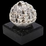 An Israeli silver Old City of Jerusalem ball sculpture, Sam Philipse, circa 1990s, on speckled base,