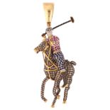 A large modern 9ct gold sapphire ruby and diamond 3-dimensional polo player pendant, pave set with